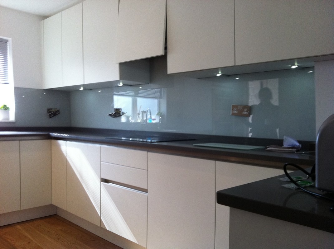 Grey glass kitchen splashback with LED lighting in Forest Gate