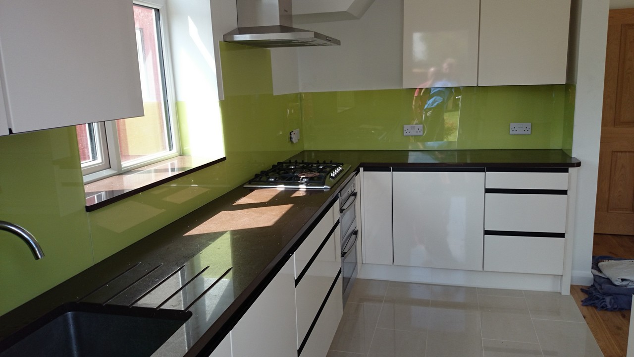 Lime green glass kitchen splashback installed by Forest Gate glaziers
